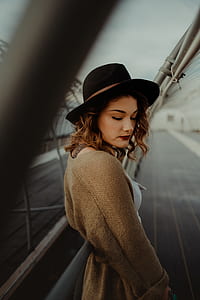 woman posing near bridge thumbnail