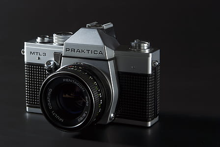 gray and black Praktica DSLR camera thumbnail