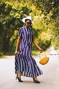 Woman Holding Yellow Handbag thumbnail