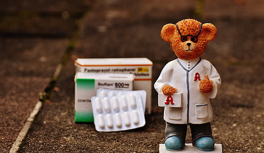 doctor bear figurine near boxes of medicine digital wallpaper thumbnail