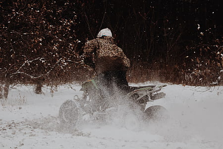 person rides ATV during daytime thumbnail