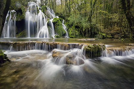 waterfall surrounded by trees at daytime thumbnail