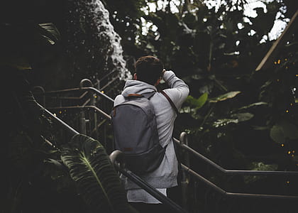 man wearing backpack thumbnail