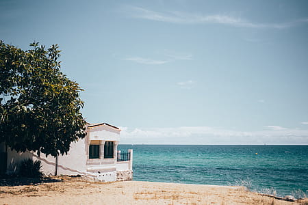 An Oceanside villa with horizon in the background thumbnail