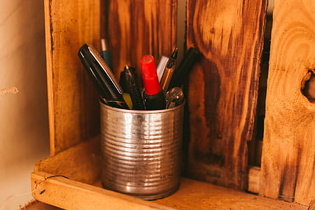 Selective Focus Photography of Pens in Silver Can thumbnail