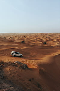 SUV on sand thumbnail