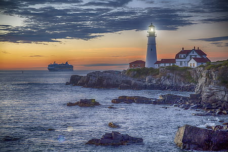 white lighthouse near seashore thumbnail