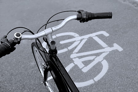 black road bike on road thumbnail