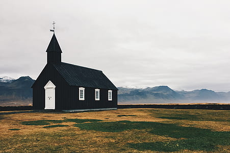 black church within mountain range during daytime thumbnail