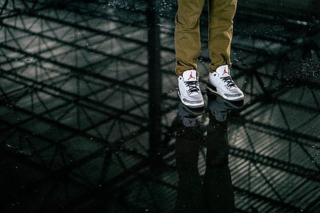 man wearing white cement Air Jordan 3 shoes thumbnail