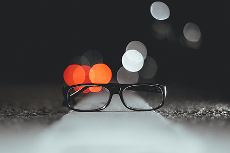 shallow focus photography of eyeglasses thumbnail