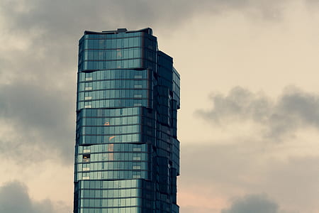 high-rise building under clear blue sky thumbnail