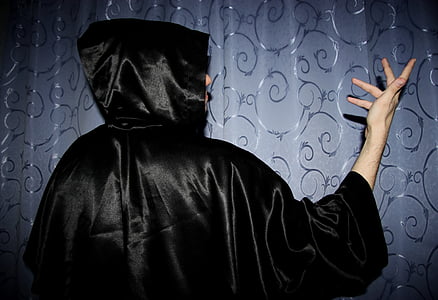 person wearing black hooded dress thumbnail