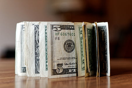 closeup photo of bundle of U.S. dollar banknotes thumbnail