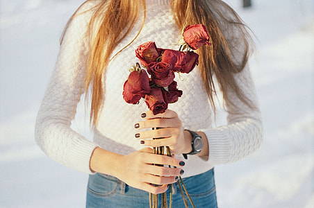 woman holding red roses thumbnail