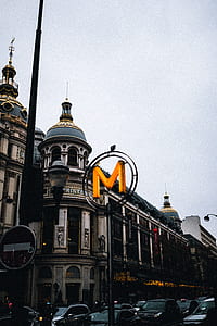 photo of M sign near building thumbnail