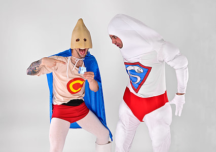 two person wearing costumes near white background thumbnail