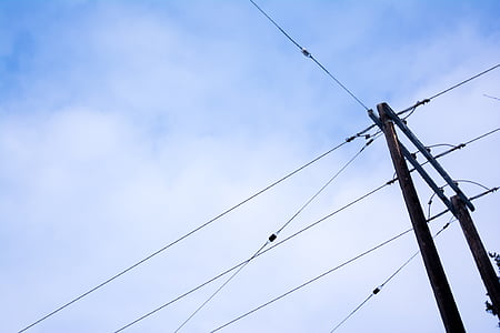 black electric post under cloudy sky thumbnail
