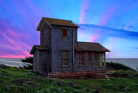 house standing on green grass field thumbnail
