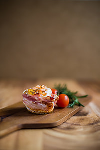 fried meat beside tomato on chopping board thumbnail