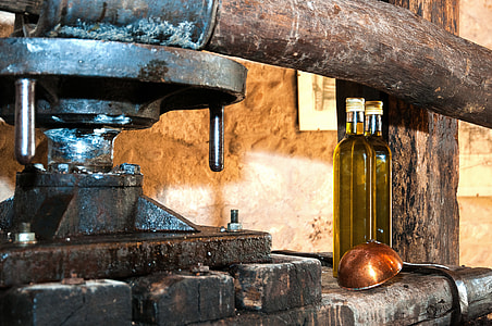 close-up photography of beverage filled bottle near black machine thumbnail