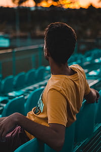 Man Sitting on Gang Chair thumbnail