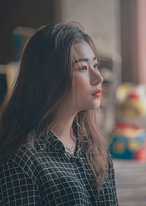 Woman Wearing White and Black Checkered Dress Top thumbnail