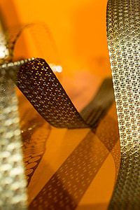 Bended golden metal on an orange background thumbnail