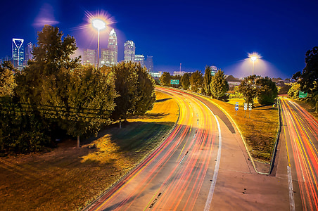 time lapse photography of cars on road thumbnail