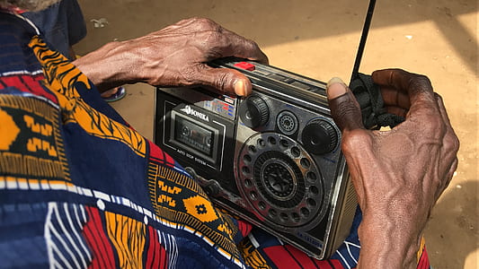 person holding radio thumbnail