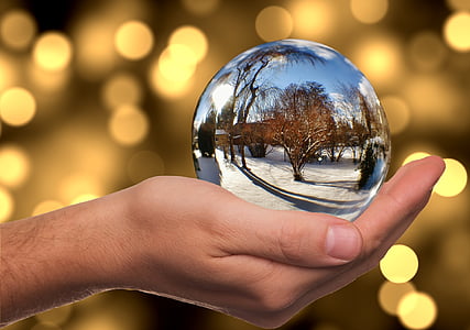 person holding snow globe thumbnail