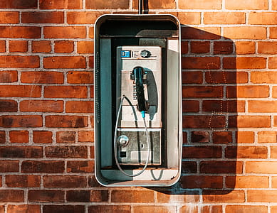 Payphone On Brick Wall Photo thumbnail