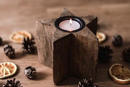 brown wooden star votive candle on table thumbnail
