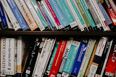 assorted-title book lot on shelf thumbnail