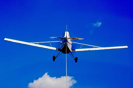 white airplane on sky thumbnail