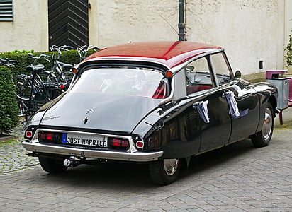 black vintage car on asphalt road thumbnail