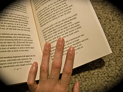 person holding opened book thumbnail
