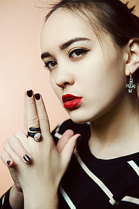 woman wearing black and white striped top thumbnail