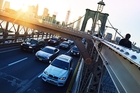 assorted-color vehicle on bridge during daytime thumbnail