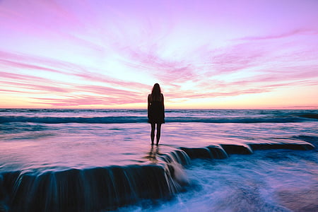 silhouette of person on body of water thumbnail