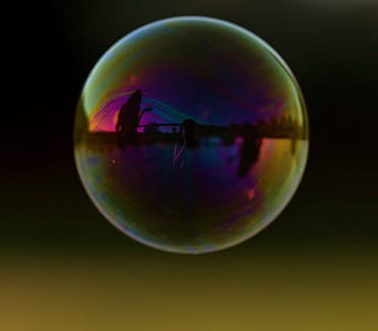 silhouette of person near body of water in bubble effect thumbnail