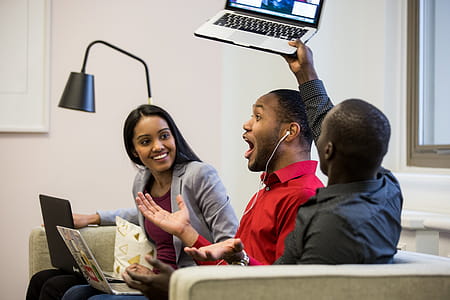 Excited Friends On Couch Photo thumbnail