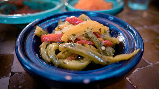 coleslaw in blue ceramic bowl on brown surface thumbnail