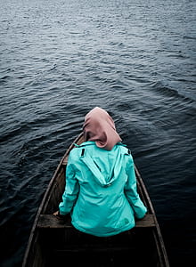 person sitting on boat thumbnail