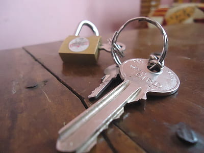 silver key on table thumbnail