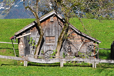 brown wooden barn around green grass field thumbnail