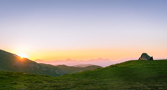 sunrise over green mountains thumbnail