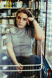 woman sitting on shopping cart thumbnail
