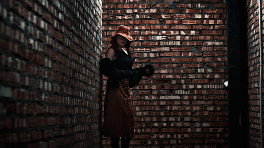 woman near brown concrete wall thumbnail