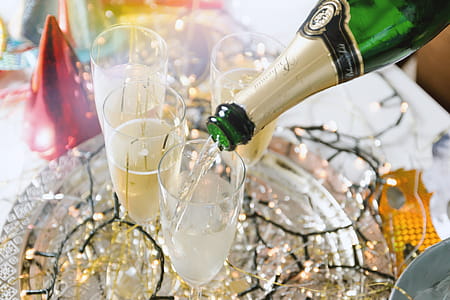Celebration! Pouring champagne into glasses. Happy New Year! thumbnail